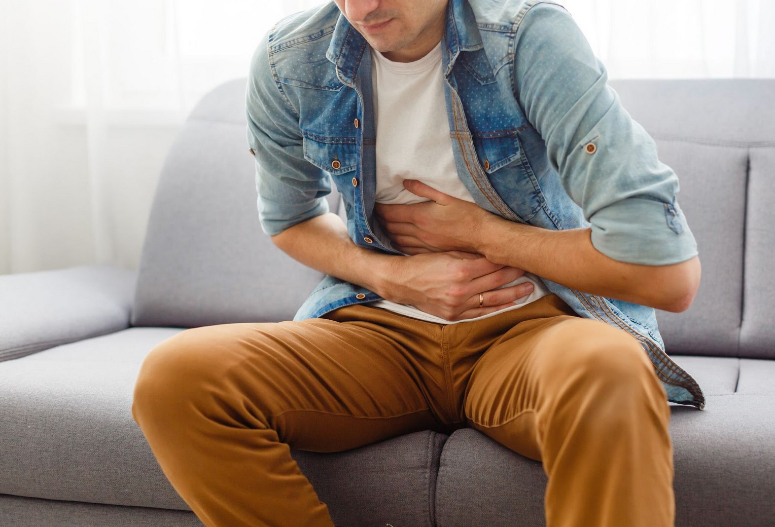 man suffering from nausea