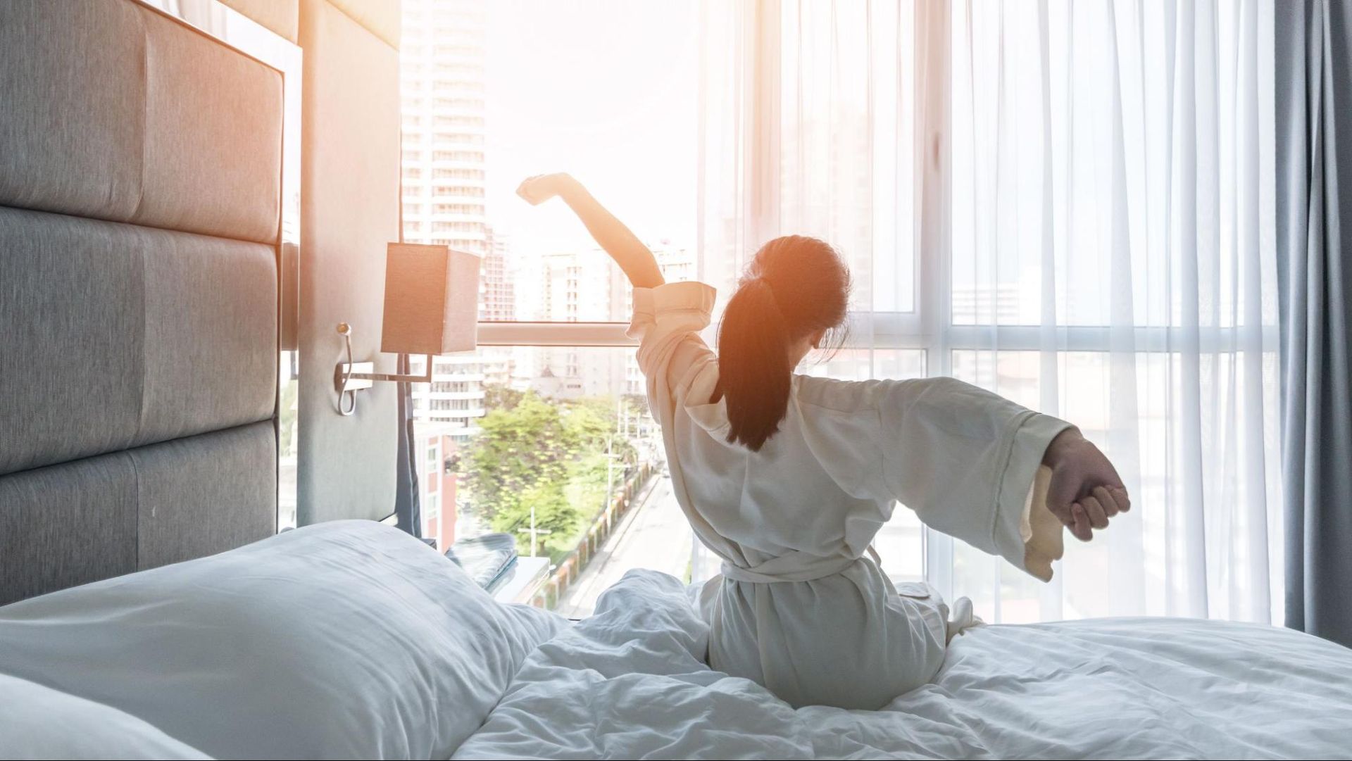 a woman waking up fresh in the morning